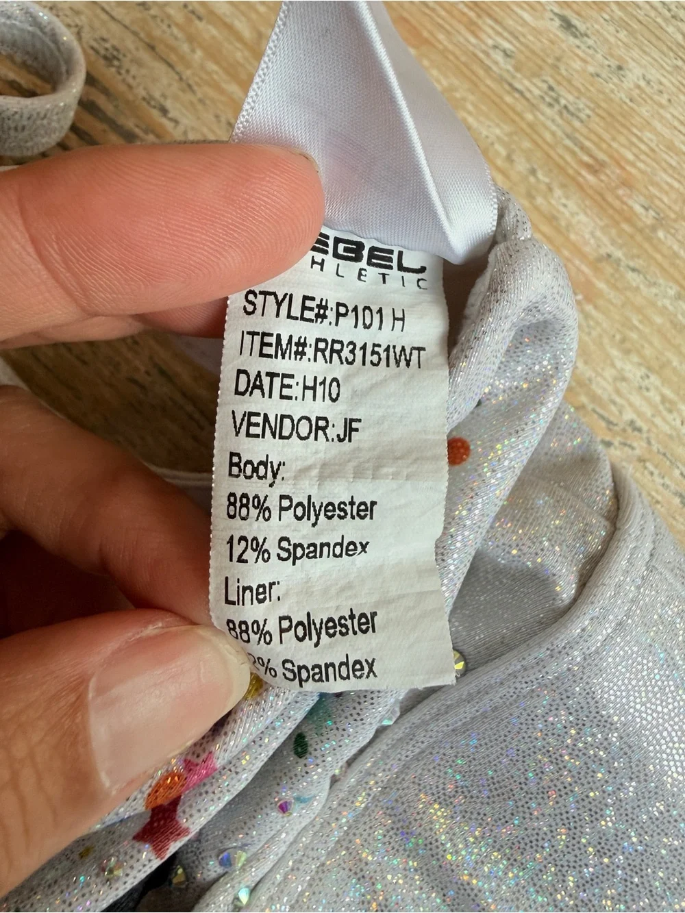 Rebel Athletic Women’s Sparkle Confetti Sports Bra with 'REBEL' Graphic - Silver